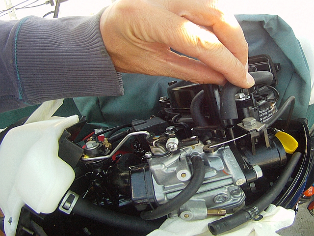 remove hose Tohatsu 3.5 HP outboard repair carburetor